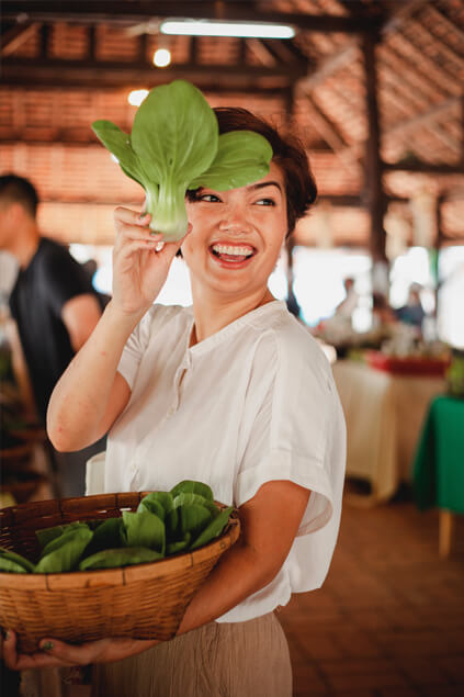 woman carrying vegetables